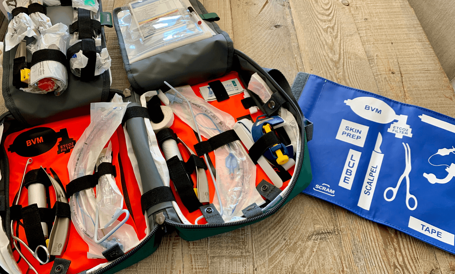 Blue CMT surgical-airway panel beside the open bag